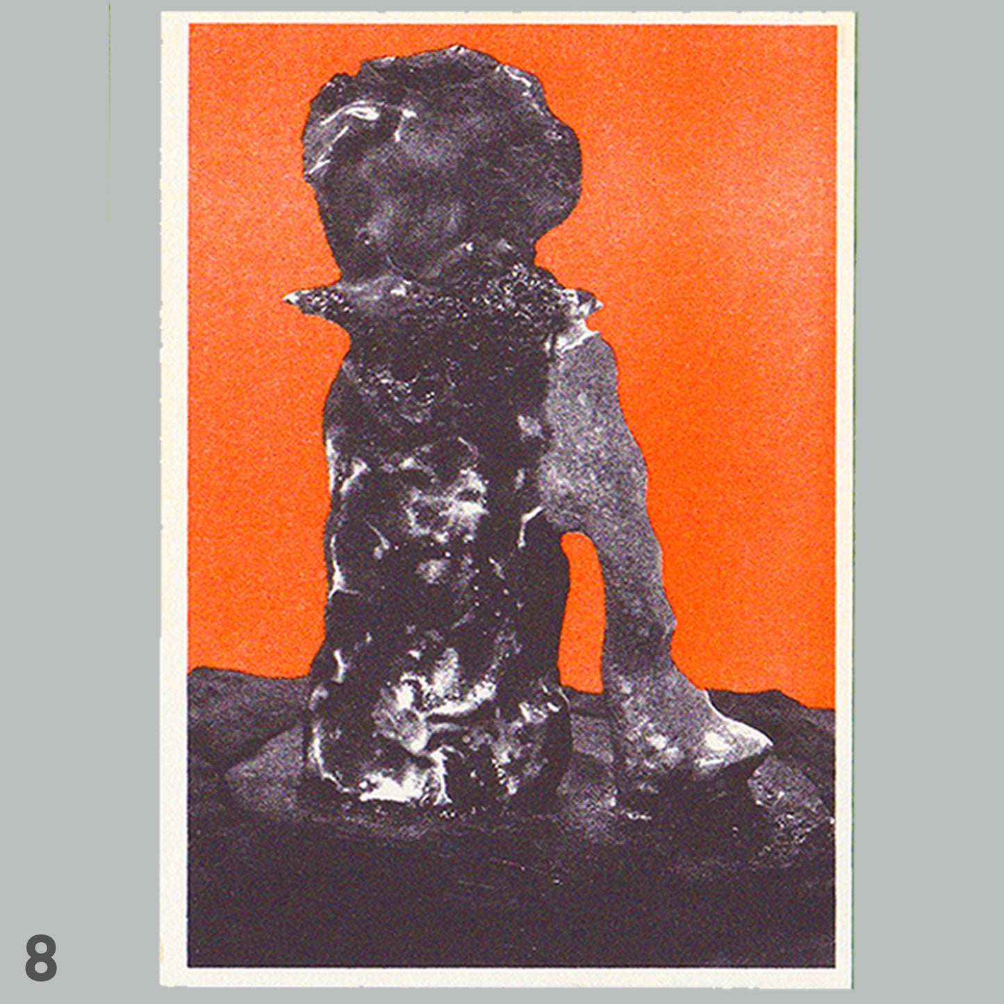 Black sculpture on a red background