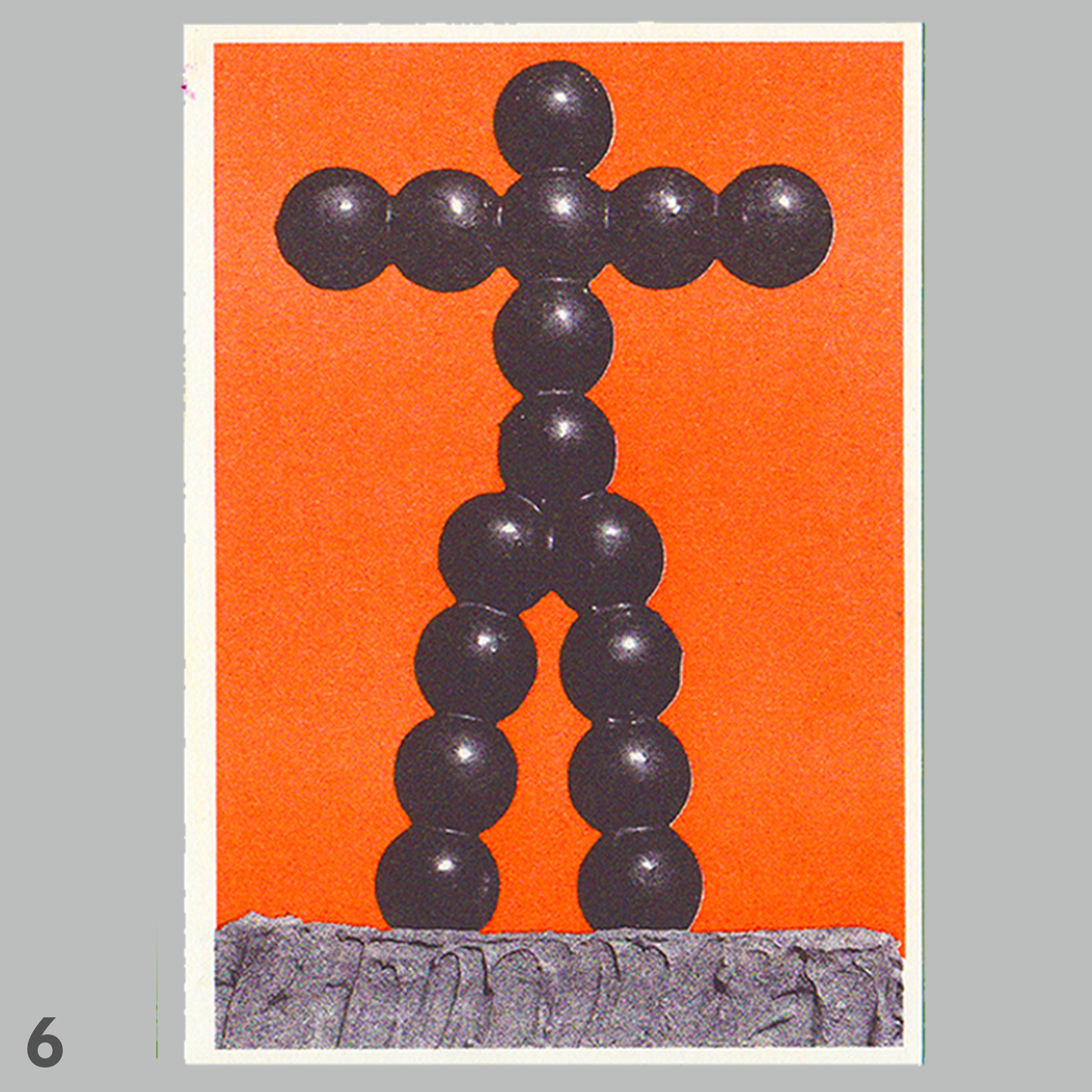 Black abstract sculpture on an orange background
